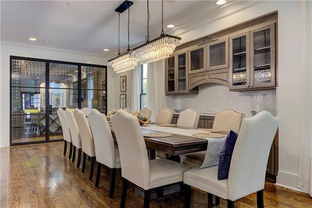 2972 Lookout Pl NE, Atlanta, GA 30305 - dining space with ornamental molding, dark wood-style floors, recessed lighting, and a chandelier