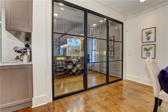 2972 Lookout Pl NE, Atlanta, GA 30305 - office with wood finished floors, crown molding, recessed lighting, and french doors