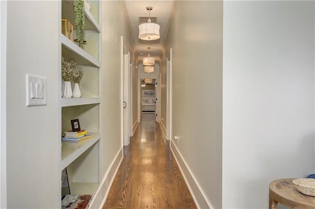 2972 Lookout Pl NE, Atlanta, GA 30305 - corridor featuring dark wood finished floors and built in shelves
