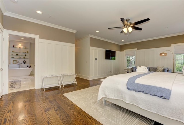 2972 Lookout Pl NE, Atlanta, GA 30305 - bedroom with a decorative wall, wood finished floors, multiple windows, recessed lighting, and crown molding
