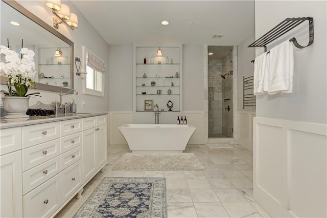 2972 Lookout Pl NE, Atlanta, GA 30305 - full bathroom featuring marble look tile flooring, a shower stall, vanity, a freestanding bath, and wainscoting