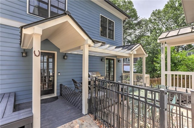2972 Lookout Pl NE, Atlanta, GA 30305 - doorway to property with a wooden deck, a pergola, and a metal roof