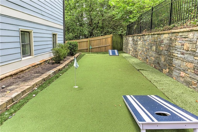 2972 Lookout Pl NE, Atlanta, GA 30305 - fenced backyard featuring a putting area