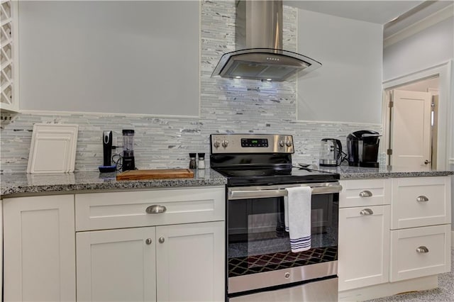 2972 Lookout Pl NE, Atlanta, GA 30305 - kitchen featuring stainless steel range with electric stovetop, wall chimney exhaust hood, light stone counters, and white cabinetry