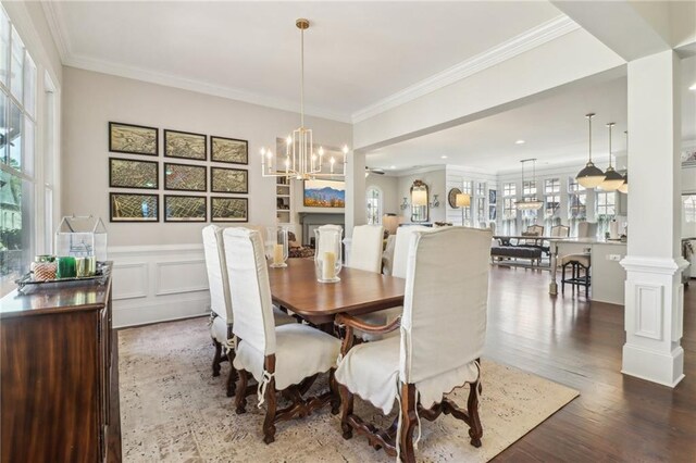 living room featuring recessed lighting, a ceiling fan, arched walkways, and ornamental molding