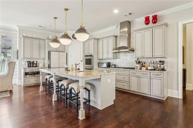 living room featuring ceiling fan, a fireplace with raised hearth, recessed lighting, and ornamental molding
