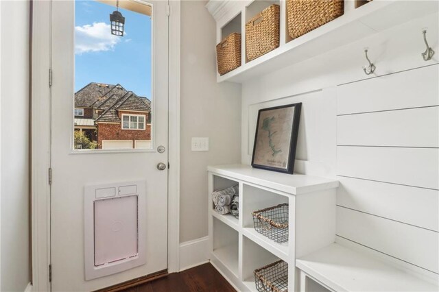 dining room with visible vents, arched walkways, dark wood-type flooring, and crown molding