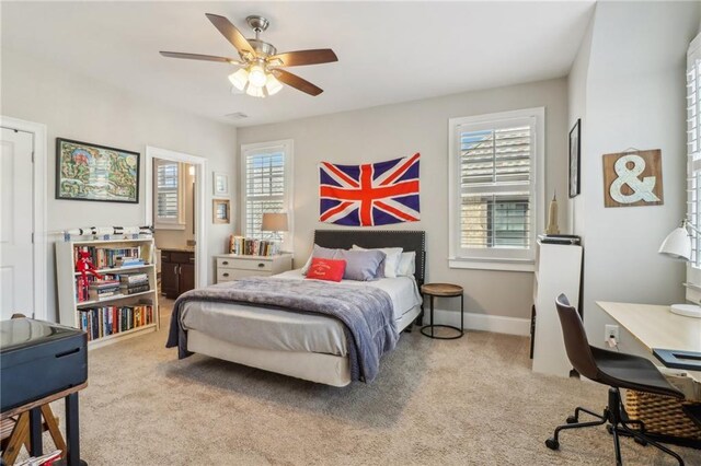 bedroom with light wood-type flooring, baseboards, a ceiling fan, and crown molding