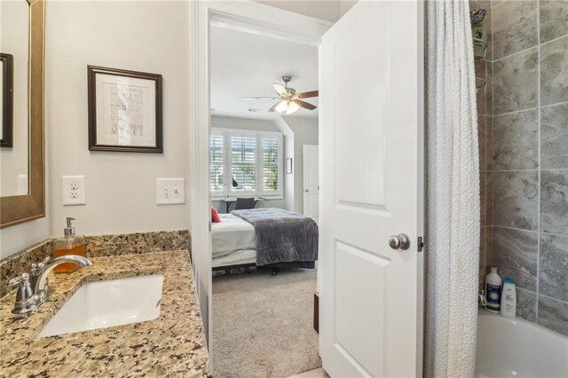laundry area featuring a sink, cabinet space, light floors, and washer and clothes dryer