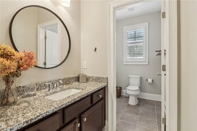 carpeted bedroom with visible vents, baseboards, a ceiling fan, and vaulted ceiling