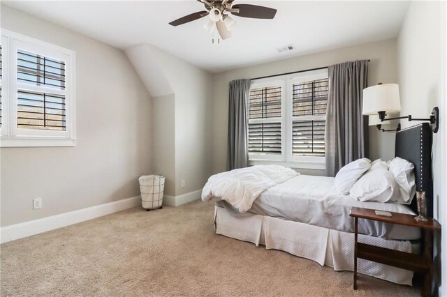 bedroom featuring baseboards and carpet
