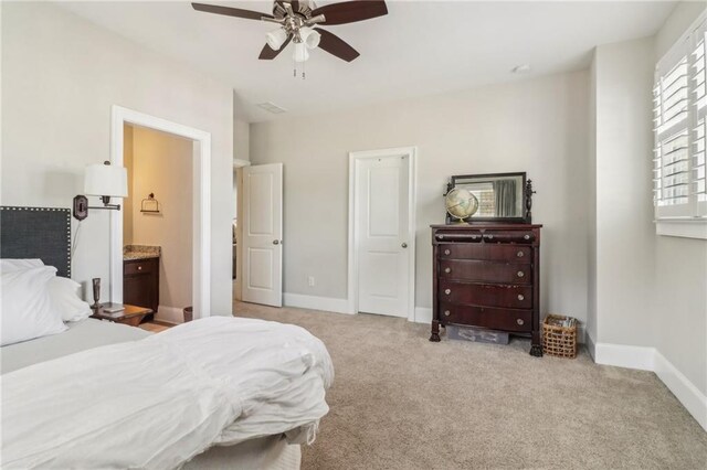 carpeted living area with crown molding, visible vents, and baseboards