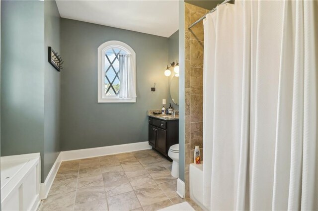 bathroom featuring vanity, toilet, a ceiling fan, and shower / tub combo with curtain