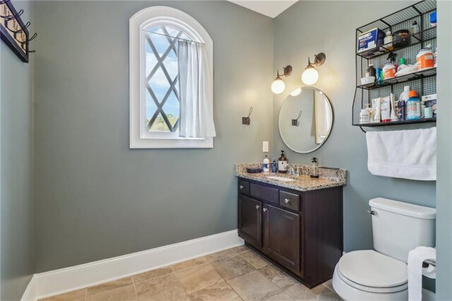 carpeted bedroom featuring visible vents, ceiling fan, and baseboards