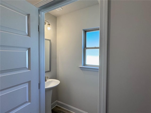 635 Forest Way, Cornelia, GA 30531 - bathroom with baseboards, wood finished floors, and a sink