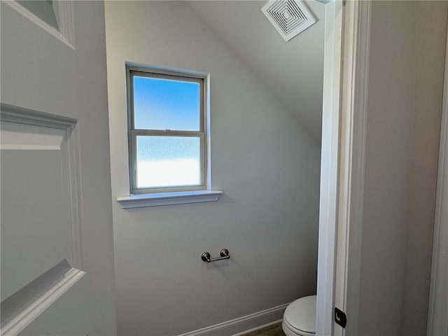 635 Forest Way, Cornelia, GA 30531 - bathroom with vaulted ceiling, toilet, and baseboards