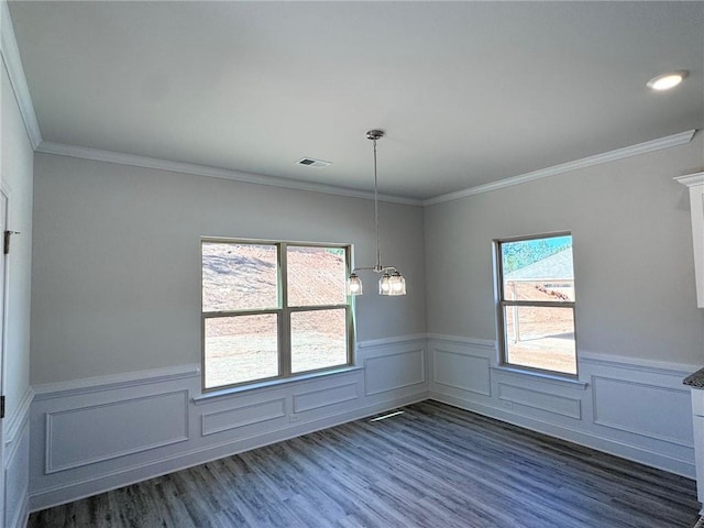 635 Forest Way, Cornelia, GA 30531 - spare room with wainscoting, dark wood-type flooring, ornamental molding, a chandelier, and a decorative wall