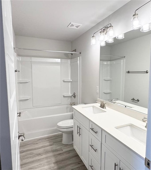 635 Forest Way, Cornelia, GA 30531 - bathroom featuring wood finished floors, toilet, shower / bath combination, and double vanity