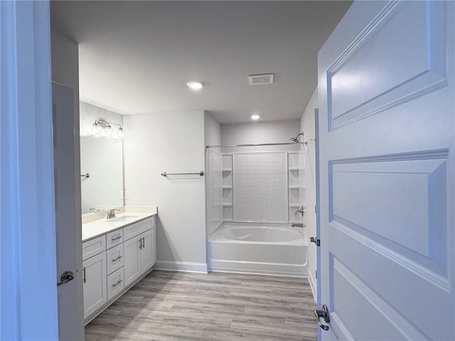 635 Forest Way, Cornelia, GA 30531 - bathroom with wood finished floors, baseboards, vanity, bathing tub / shower combination, and recessed lighting