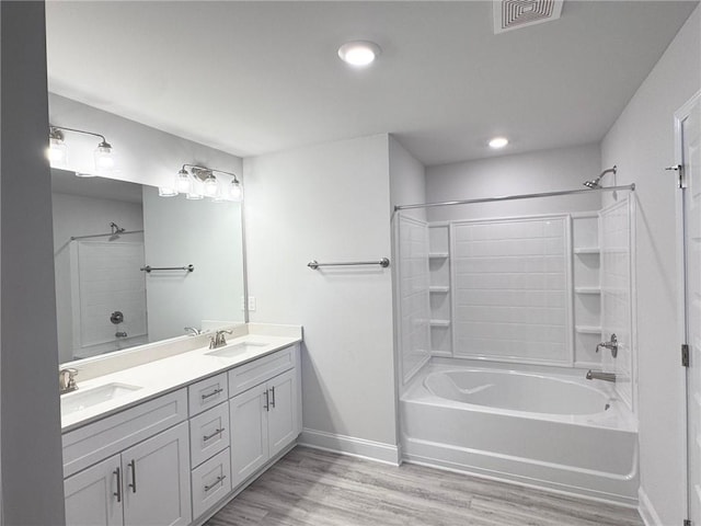 635 Forest Way, Cornelia, GA 30531 - full bathroom featuring baseboards, wood finished floors, shower / bathtub combination, double vanity, and recessed lighting
