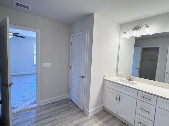 635 Forest Way, Cornelia, GA 30531 - bathroom with wood finished floors, vanity, baseboards, and a ceiling fan