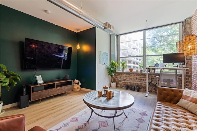 living room featuring baseboards and wood finished floors