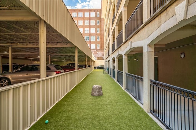 view of home's community featuring covered parking
