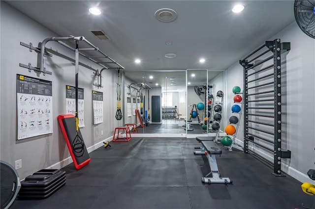 exercise room featuring baseboards, visible vents, and recessed lighting