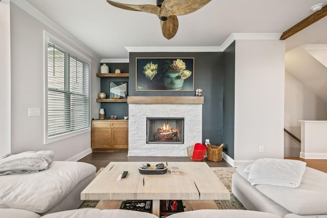 5217 Riden Ct Unit 263, Buford, GA 30518 - living room featuring plenty of natural light, ceiling fan, baseboards, ornamental molding, and a stone fireplace