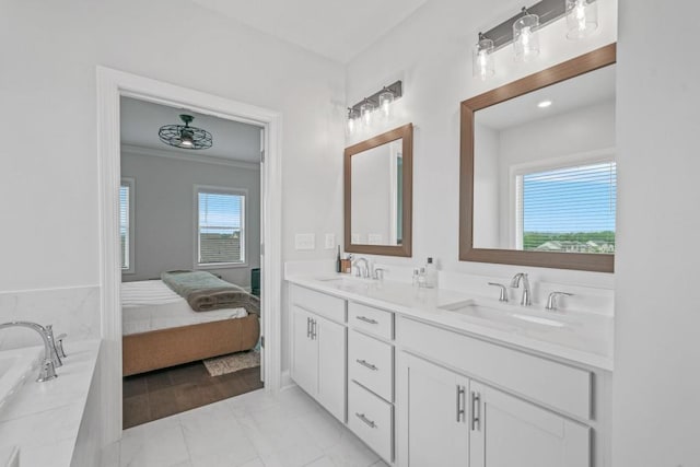 5217 Riden Ct Unit 263, Buford, GA 30518 - ensuite bathroom featuring double vanity, a tub, ornamental molding, and marble finish flooring