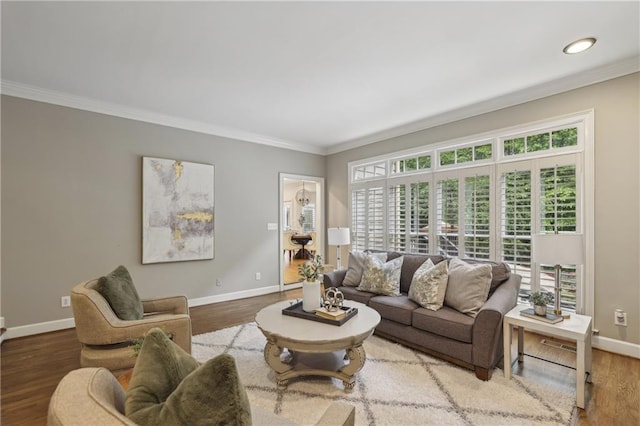 living room with crown molding, baseboards, wood finished floors, and recessed lighting