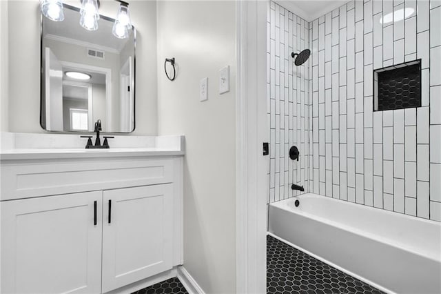 full bathroom with visible vents, ornamental molding, tile patterned floors, vanity, and shower / washtub combination