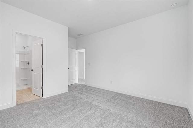 unfurnished bedroom featuring light colored carpet