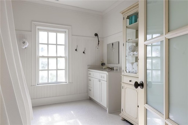 full bath featuring vanity and crown molding