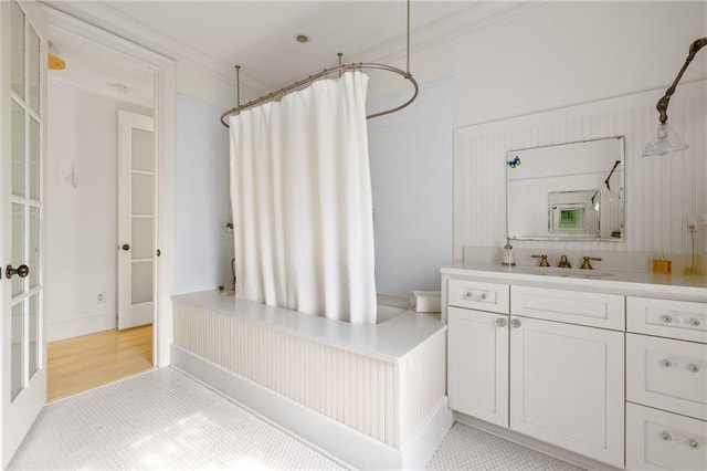 bathroom featuring crown molding, wood finished floors, vanity, and a shower with curtain