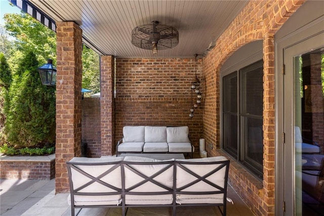 view of patio featuring a ceiling fan and an outdoor hangout area