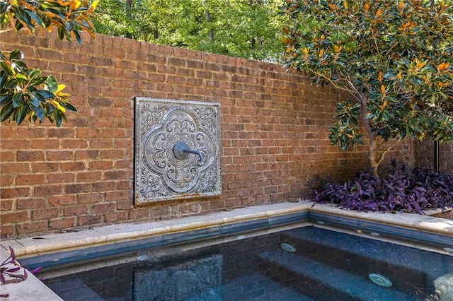 exterior details featuring a jacuzzi