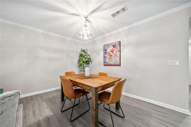 705 Beaufort Cir, Duluth, GA 30096 - dining space with a chandelier, wood finished floors, baseboards, and ornamental molding