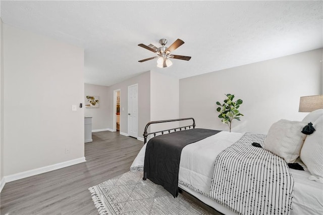 705 Beaufort Cir, Duluth, GA 30096 - bedroom with wood finished floors, baseboards, and ceiling fan