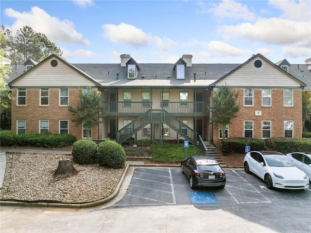 705 Beaufort Cir, Duluth, GA 30096 - view of property with stairs and uncovered parking