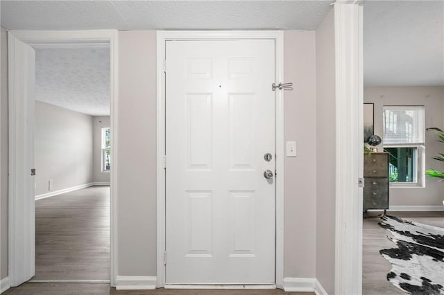 705 Beaufort Cir, Duluth, GA 30096 - foyer featuring baseboards and a textured ceiling
