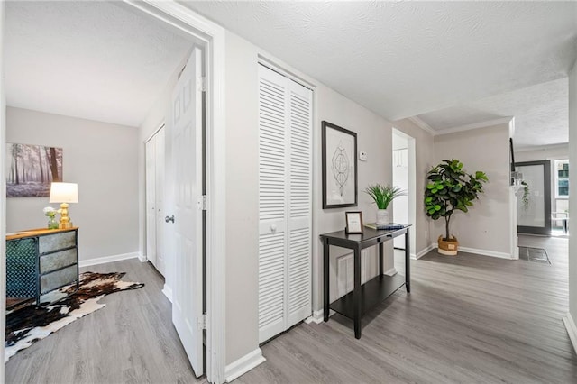 705 Beaufort Cir, Duluth, GA 30096 - corridor featuring wood finished floors, a textured ceiling, and baseboards