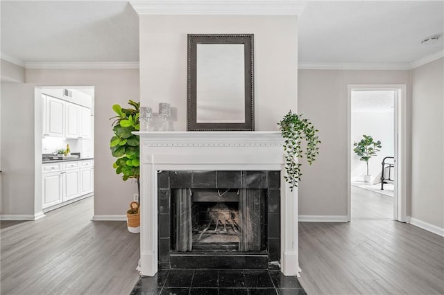 705 Beaufort Cir, Duluth, GA 30096 - living room with a fireplace, ornamental molding, baseboards, and wood finished floors