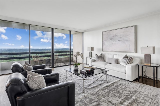 2660 Peachtree Rd NW Unit 23A, Atlanta, GA 30305 - living room featuring floor to ceiling windows, crown molding, wood finished floors, and healthy amount of natural light