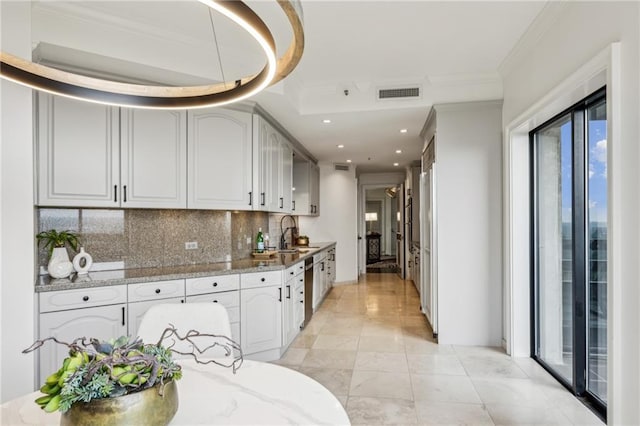 2660 Peachtree Rd NW Unit 23A, Atlanta, GA 30305 - kitchen with decorative backsplash, light stone countertops, recessed lighting, ornamental molding, and stainless steel dishwasher
