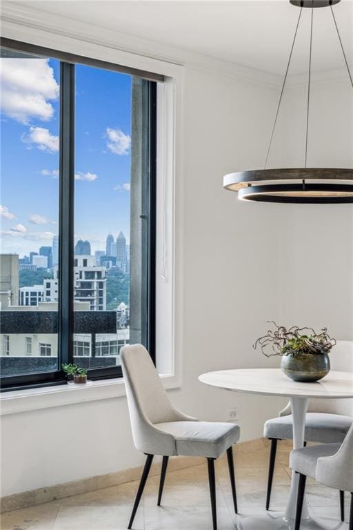 2660 Peachtree Rd NW Unit 23A, Atlanta, GA 30305 - dining room with a skyline view and ornamental molding