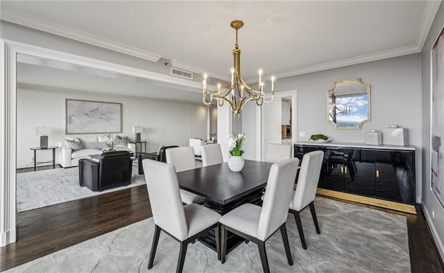 2660 Peachtree Rd NW Unit 23A, Atlanta, GA 30305 - dining space with a chandelier, wood finished floors, and crown molding