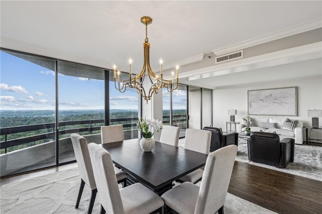 2660 Peachtree Rd NW Unit 23A, Atlanta, GA 30305 - dining space with a chandelier, crown molding, wood finished floors, and a wall of windows
