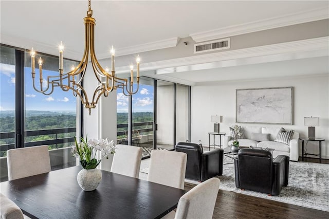 2660 Peachtree Rd NW Unit 23A, Atlanta, GA 30305 - dining room featuring a chandelier, floor to ceiling windows, crown molding, and wood finished floors