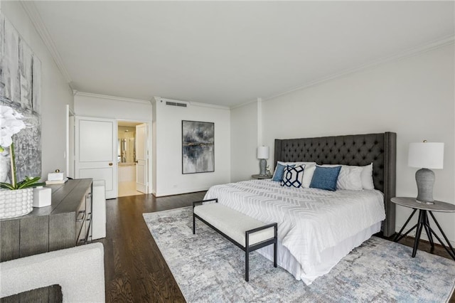 2660 Peachtree Rd NW Unit 23A, Atlanta, GA 30305 - bedroom with ornamental molding, dark wood-type flooring, and ensuite bathroom